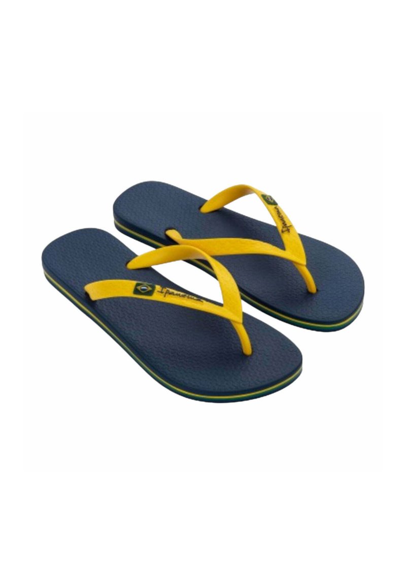 Infradito in gomma blu con cinturini gialli e dettagli verdi. Soletta testurizzata e supporto dell'arco. Design leggero per un uso casual.