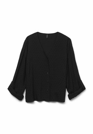 Czarna bluzka z dekoltem w szpic, krótkimi rękawami i zapięciem na guziki z przodu. Wykonana z teksturowanej tkaniny z drobnymi kropeczkami. Krótka forma z wywiniętymi detalami na rękawach.