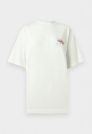 White oversized t-shirt with short sleeves and small colorful "SUNSET est. 1972" text and abstract design on upper left chest.
