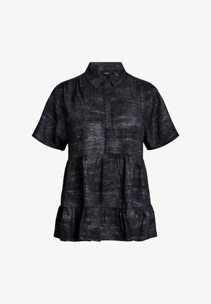 Trumpas rankovėmis juodas tekstūruotas bliusonas su sluoksniuota volančia apatine dalimi ir klasikiniu apykaklės dizainu, kuriame yra slepiamas priekinis mygtukų užsegimas.