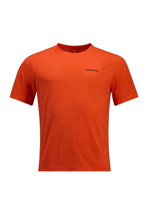 Camiseta corta de manga naranja hecha de tejido suave. Cuenta con un escote redondo y un logo negro "ROSSIGNOL" en el frente.
