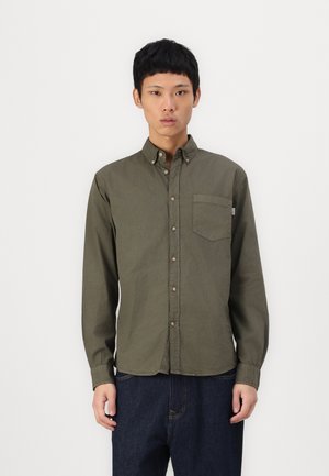 Olive green long-sleeve shirt with a button-down collar, front pocket, and brown buttons. The fabric appears smooth and lightweight.