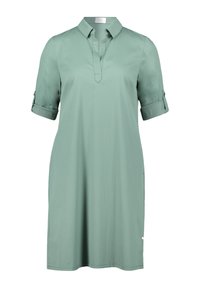Hellgrünes Baumwollkleid mit Kragen, kurzen aufgerollten Ärmeln und seitlichen Taschen; verfügt über eine knopflose Leiste und eine lockere Passform.