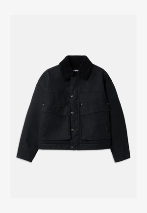 Black jacket with a textured, black shearling collar. Features front button closure and two large chest pockets. Material appears sturdy.
