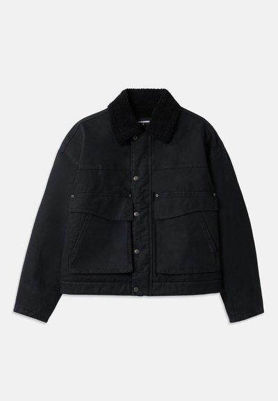 Black jacket with a textured, black shearling collar. Features front button closure and two large chest pockets. Material appears sturdy.