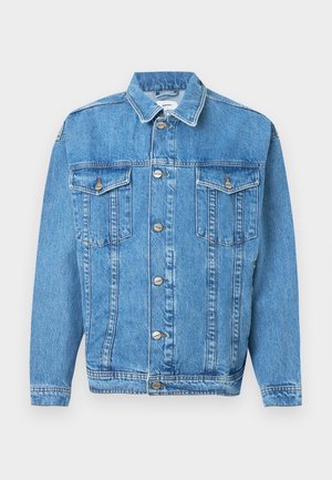 Heledad sinine teksajakk, millel on nööbiga sulgemine, kaks rinna taskut ja kraega kaelus. Omab õmblusdetailide ja lõdva istuvuse.