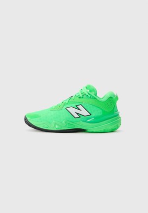 Bright green athletic sneaker with black sole, white "N" logo on side, laces, and textured design, facing left on plain background.
