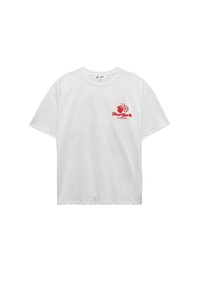 Witte kortek  mouw t-shirt met een rode grafische ontwerp met de tekst "New York" en harten. Katoenen stof met een relaxte fit.