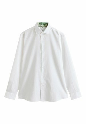 Biela košeľa s dlhým rukávom, gombíkmi, s klasickým golierom a jemnou kvetinovou potlačou vo vnútri goliera.