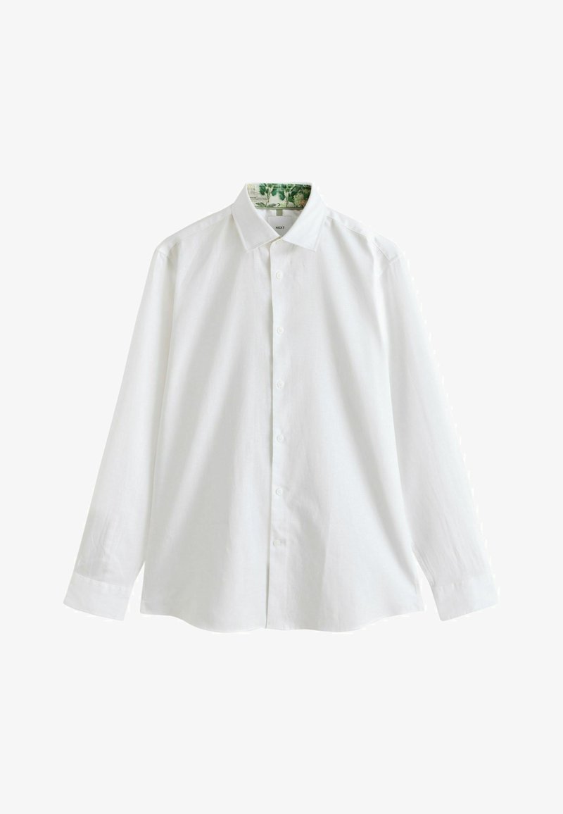Chemise blanche à manches longues boutonnée avec col classique et motif floral subtil à l'intérieur du col.