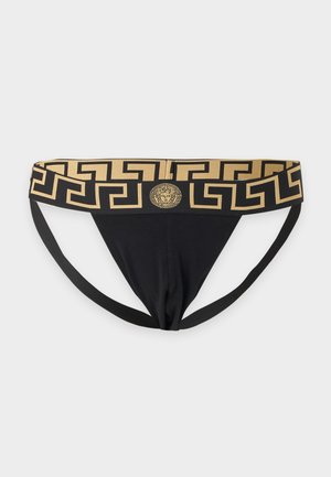 Suspensorio negro con cinturilla ancha de patrón geométrico en oro y negro que presenta un emblema central con cabeza de Medusa.