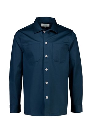 Laivaston sininen napitettava paita, joka on valmistettu sileästä kankaasta. Paidassa on avara kaulus, kaksi rintataskua sekä valkoiset napit edessä ja hihoissa.