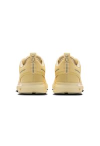 Yellow athletic shoes with mesh fabric, rounded heel, reflective accents, and a cushioned sole, featuring a logo tag on the back.