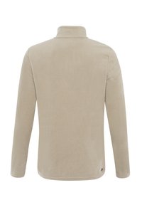 Pullover in pile beige con colletto alto, maniche lunghe e superficie texturizzata. Presenta un orlo arrotondato e un piccolo logo dettagliato alla base.