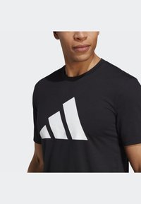 adidas Performance ESSENTIALS FEELREADY - Sports T-shirts - black/white