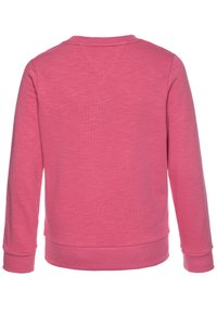 Sudadera rosa de manga larga, con cuello redondo y puños y dobladillo de canalé. La tela tiene una textura suave con un aspecto ligeramente jaspeado.