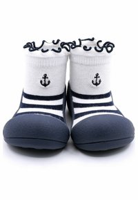 Botitas de goma navy con suela de goma y parte superior elástica blanca. Presentan rayas navy y blancas y un pequeño bordado de ancla en la parte delantera.