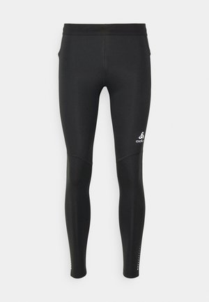 Zwarte hardlooptights gemaakt van rekbaar, soepel materiaal. Beschikt over een aangesloten ontwerp met subtiele logo en geperforeerde accenten nabij de enkels.
