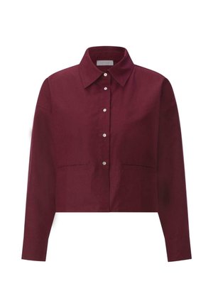 Cămașă burgundy cu guler, cropped, cu mâneci lungi și două buzunare frontale. Confecționată dintr-un material neted cu un finisaj mat.