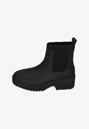 Bottines noires en matériau lisse avec des panneaux en textile côtelés, semelle en caoutchouc plate et une languette au talon pour un enfilage facile.