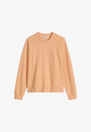 Jasnoróżowa bluza z okrągłym dekoltem, długimi rękawami, ściągaczami na mankietach i u dołu oraz detalami raglanowych szwów.