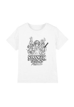 White t-shirt with black line art of seven children holding weapons, centered text "Stranger Things Tales from 85" below them.