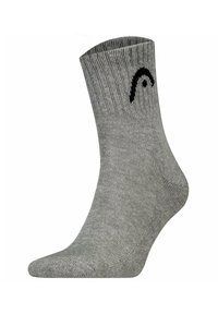 Calcetín de algodón gris con textura acanalada, altura hasta el tobillo y un acento de logo negro en el lateral. Presenta un diseño reforzado en la puntera y el talón.