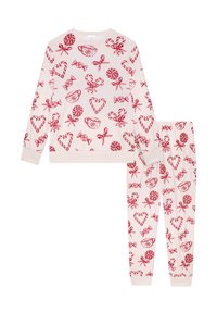 Kaksiosainen pyjama setti pehmeässä, kerma värisessä kankaassa. Sisältää punaisia makeisia ja sydämiä koristavia kuvioita. Mukana pitkähihoinen paita ja joustovyötäröiset housut.