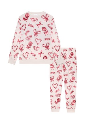 Sæt med to dele pyjamas i blødt, krämfarvet stof. Udstyret med røde slik- og hjerteprint. Inkluderer en langærmet top og bukser med elastisk liv.