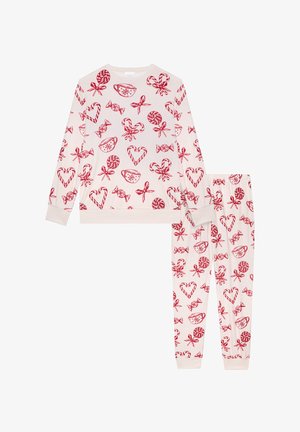 Sæt med to dele pyjamas i blødt, krämfarvet stof. Udstyret med røde slik- og hjerteprint. Inkluderer en langærmet top og bukser med elastisk liv.