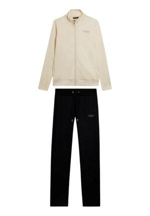 Completo tuta con giacca beige con zip e pantaloni neri con coulisse, entrambi con logo "FREDDY".