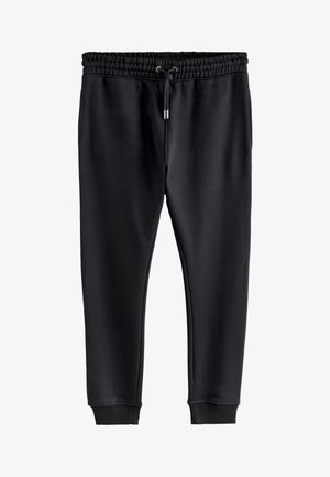 Svarta mjukisbyxor i mjukt tyg med elastisk midja och dragsko samt ribbade muddar vid anklarna.