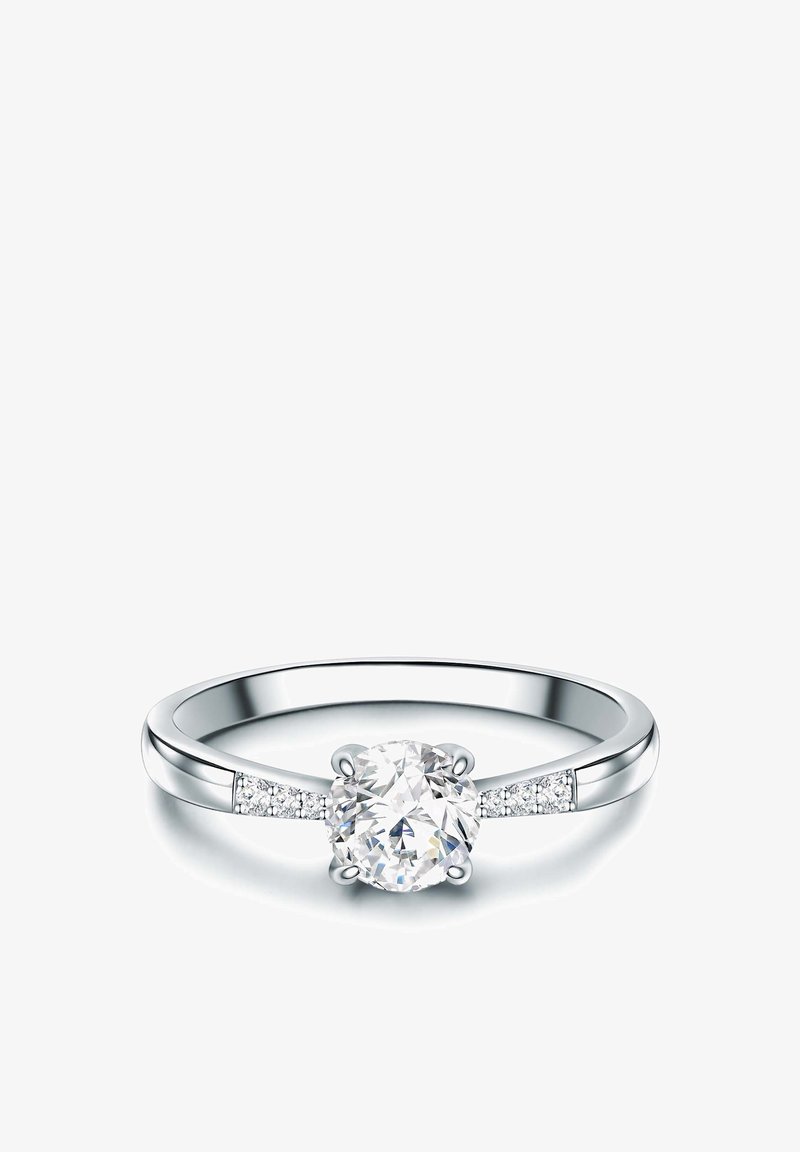 Prstan z okroglim rezom z diamantom v beli zlati. Osrednji kamen obdan z manjšimi akcentnimi diamanti. Gladek pas z polirano površino.