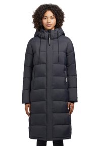 Long black puffer coat with a hood, featuring a zippered front, large square quilting pattern, and two side pockets. Adjustable drawstrings present.