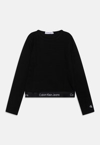 Schwarzes, kurz geschnittenes Langarmoberteil aus geripptem Material, mit rundem Halsausschnitt und einem elastischen Band mit dem "Calvin Klein Jeans" Logo am Saum und den Ärmeln.