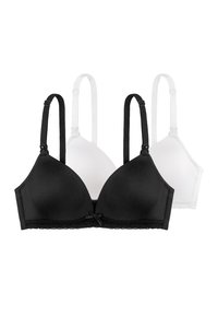 Schwarz-weiße nahtlose BHs besitzen eine dreieckige Form, verstellbare Träger und eine Spitzenverzierung beim schwarzen Modell, ergänzt durch ein kleines Schleifendetail.