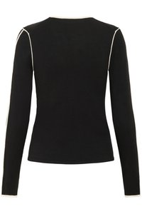 Mustas pikkade varrukatega pluus ümara kaelusega, millel on kontrastsed valged õmblused õlgadel ja äärel. Siidine tekstuur.