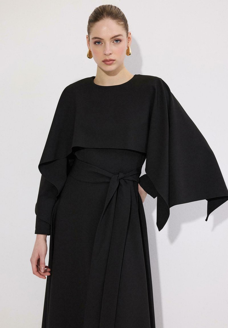 orange and black striped dress Black crêpe dress with cape sleeves main image 1
