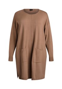 Rudos spalvos ilgas kardiganas, pagamintas iš minkštos medžiagos. Turi apvalų iškirptę, ilgus rankovus, dvi priekinės kišenes ir šonines skylutes apačioje.