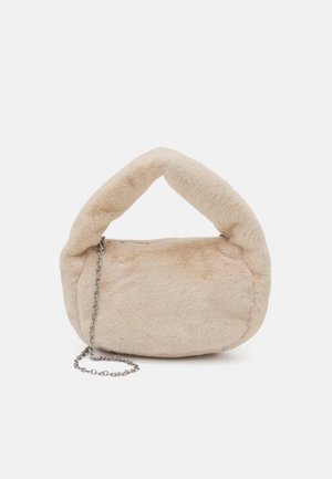 Beige faux fur handbag with a curved handle and a metallic chain strap. Soft texture, rounded shape, and zip closure.