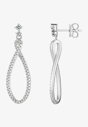 Sølvsmykkerne har et uendelighedsdesign med en glat overflade og er prydet med små klare krystaller langs kanterne samt en enkelt sten øverst.