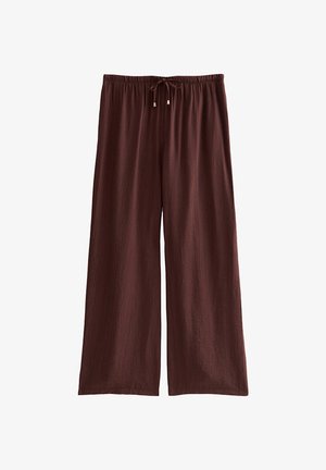 Pantalones marrones de pierna ancha con cintura elástica y cordón, hechos de tela ligera y texturizada.