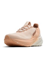 Light peach running shoe with a breathable mesh upper, textured sides, and a cushioned sole. Features neutral accents and logo detail.