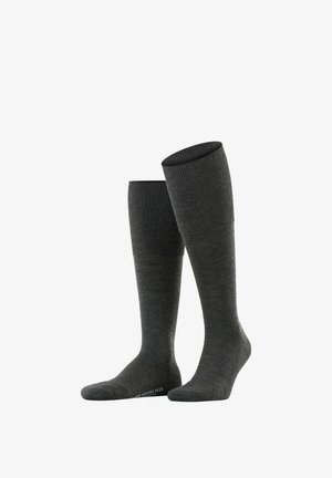 Calzini grigi al ginocchio realizzati in maglia a coste, con una fascia superiore testurizzata e tallone rinforzato per durata e comfort.