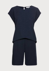 Niebieski top z krótkim rękawem i dopasowane szorty do kolan z zapięciem na guziki z tyłu w kształcie klucza, wyeksponowane na białym tle.