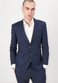 Navy blue tailored suit with a textured finish. Features two buttons, notched lapels, and pockets. White dress shirt visible underneath.