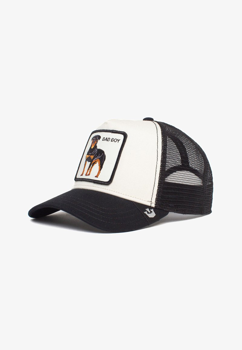 Trucker cap with a black bill, cream front, and mesh back. Features an embroidered Rottweiler patch with "BAD BOY" text.