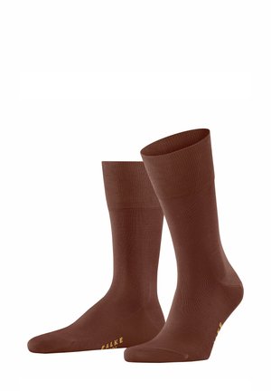 Braune Baumwollsocken mit glatter Textur, gerippten Bündchen und goldener Markierung an der Sohle. Klassisches Design mit mittellanger Oberschenkel-Länge.