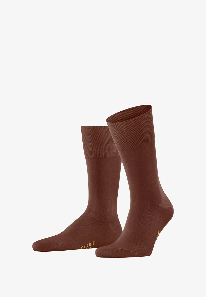 Braune Baumwollsocken mit glatter Textur, gerippten Bündchen und goldener Markierung an der Sohle. Klassisches Design mit mittellanger Oberschenkel-Länge.