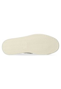 Zwarte sneakersole met een gestructureerde witte rubberen onderkant, voorzien van een zigzagpatroon en een logo in het midden.